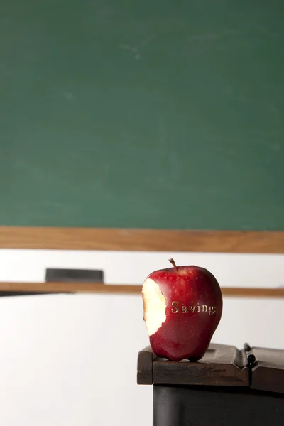 Apple in front of blackboard — Stock Photo, Image