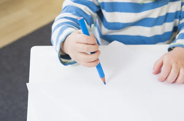 Toddler showing a poor pencil grip