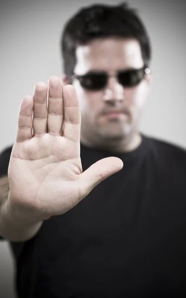 Bouncer makes Stop gesture — Stock Photo, Image
