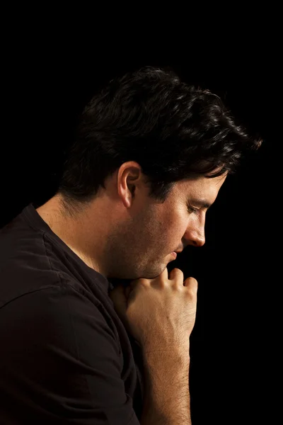 Young man prays — Stock Photo, Image