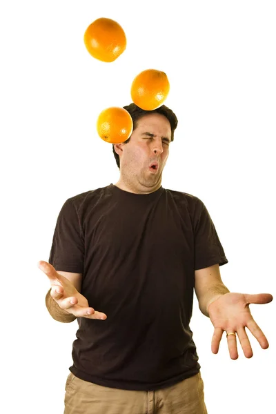 Man drops oranges while juggling — Stock Photo, Image