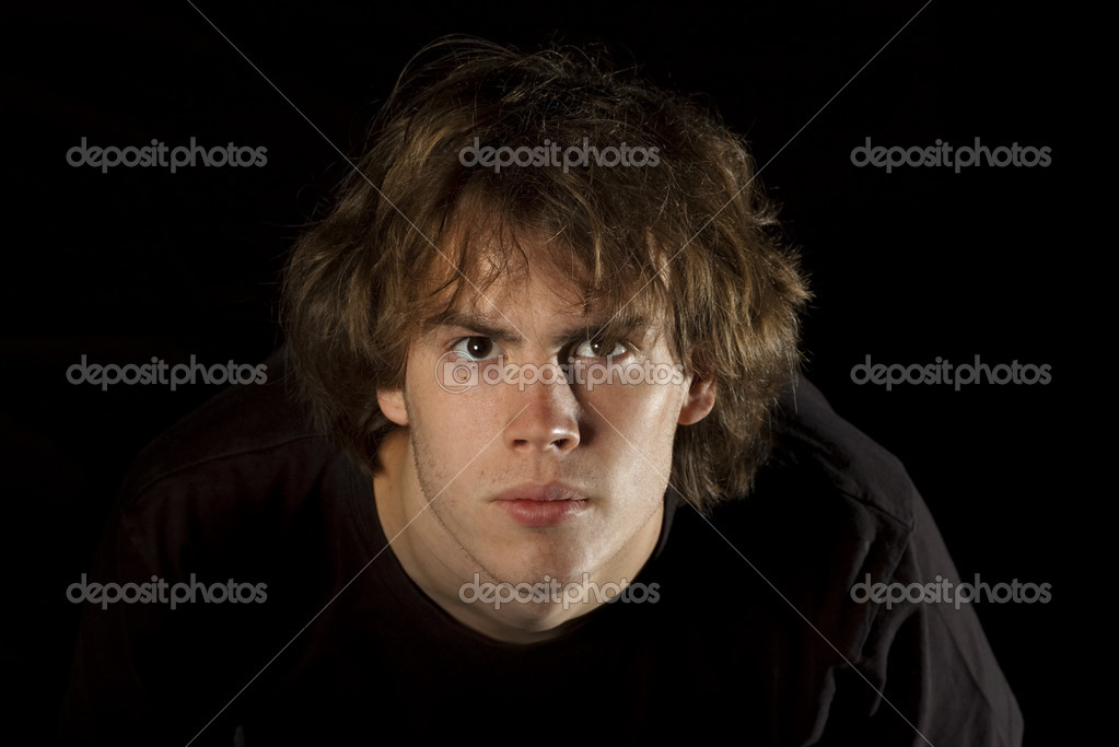Young man looks intently Stock Photo by ©dcdp 19205729 Young man looks intently Stock Photo by ©dcdp 19205729