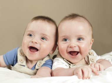 Smiling happy twin boys clipart