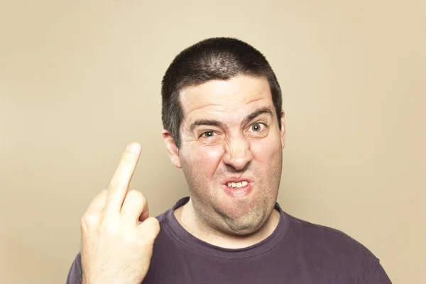 Angry man giving the finger — Stock Photo, Image