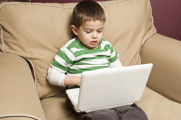 Young boy using a netbook — Stock Photo, Image