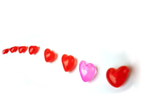 Rote und rosa Herzen aus Plastik — Stockfoto