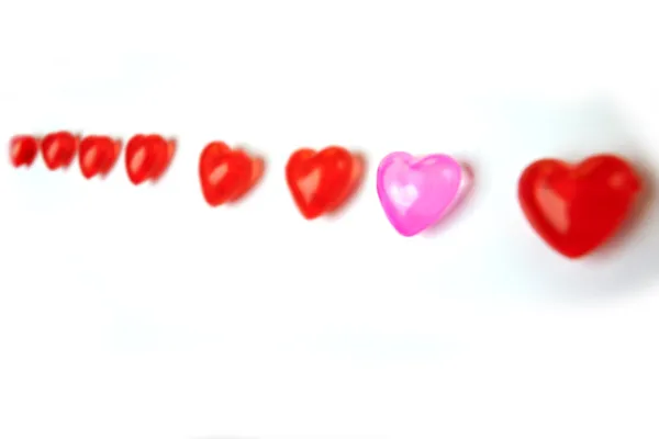 Plastic red and rose hearts — Stock Photo, Image