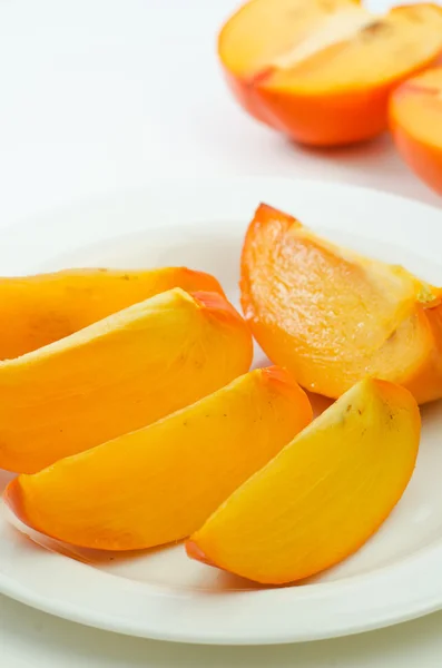 Cut persimmon fruit — Stock Photo, Image