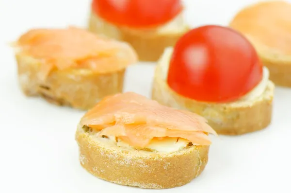 Small canapes with salmon — Stock Photo, Image