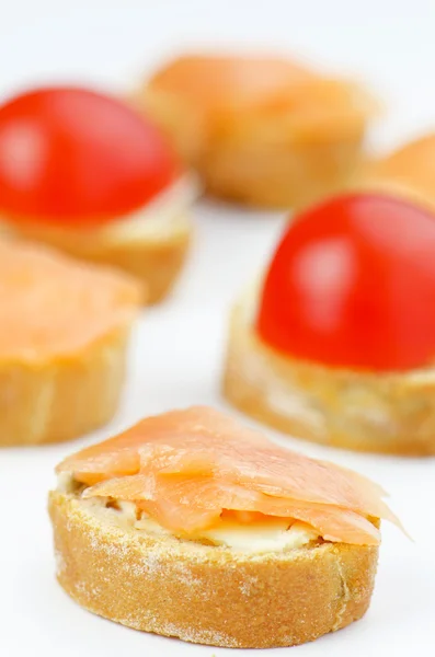 Small canapes with salmon — Stock Photo, Image