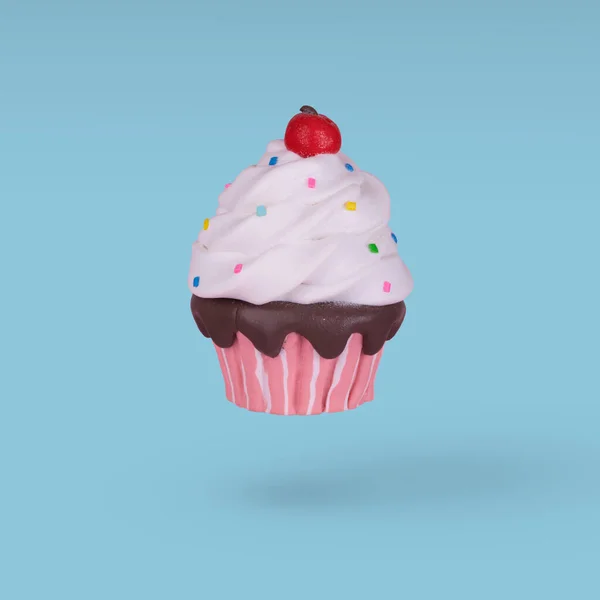 Cupcake Coloré Volant Isolé Sur Fond Bleu Vif Concept Minimal — Photo