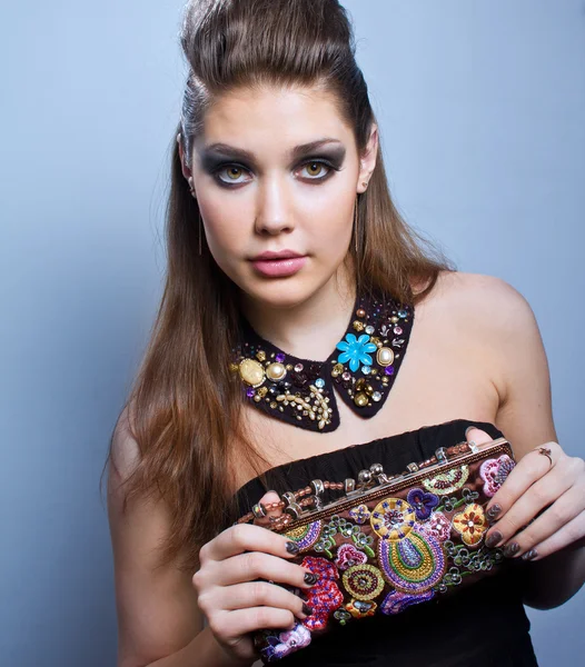 Portrait of young beautiful brunette woman wearing accessories — Stock Photo, Image