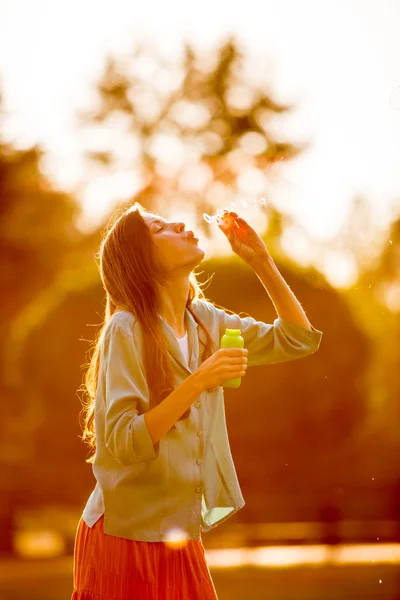 Vintage photo of woman blowing bubbles — Stock Photo, Image