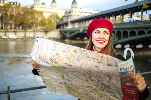 Happy tourist woman in Paris