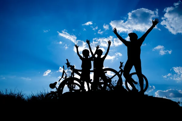 Happy family with bikes — Stock Photo, Image