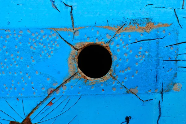 Dark hole on metal plate — Stock Photo, Image