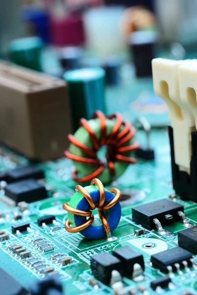 Close up of an mini electronic printed ferrite ring with compute — Stock Photo, Image