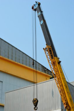 Yellow crane working clipart