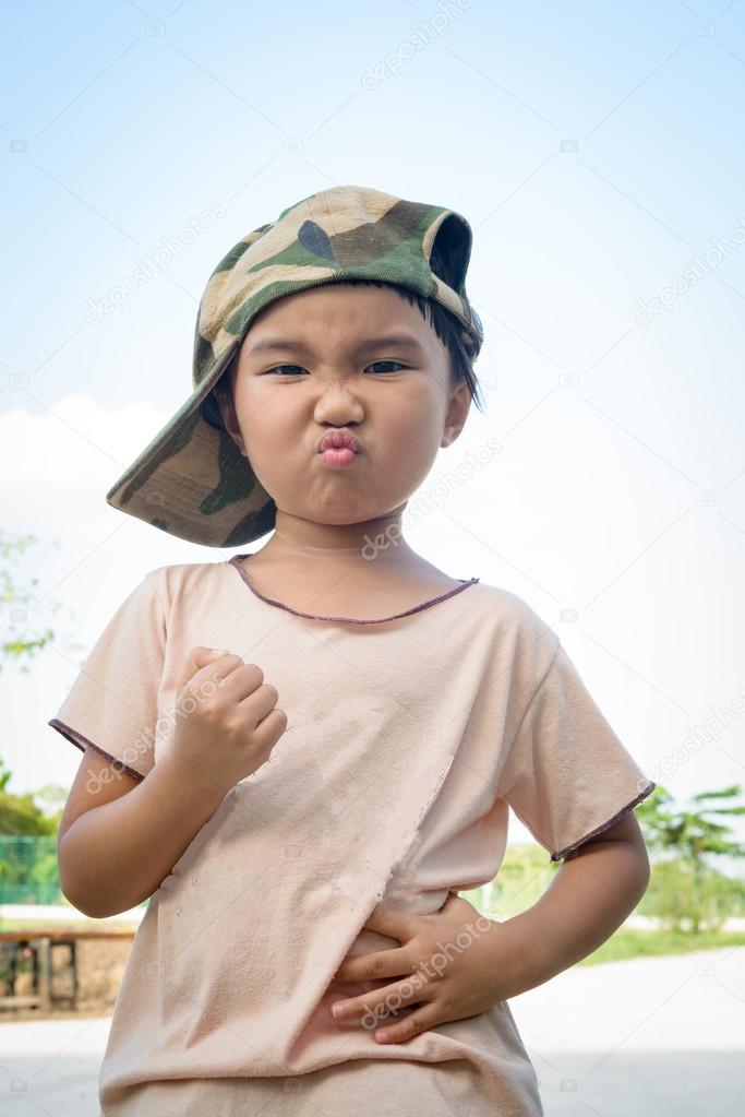Asian kid with soldier cap 
