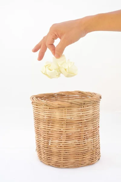 Guy hand trashing garbage to rattan bin — Stock Photo, Image