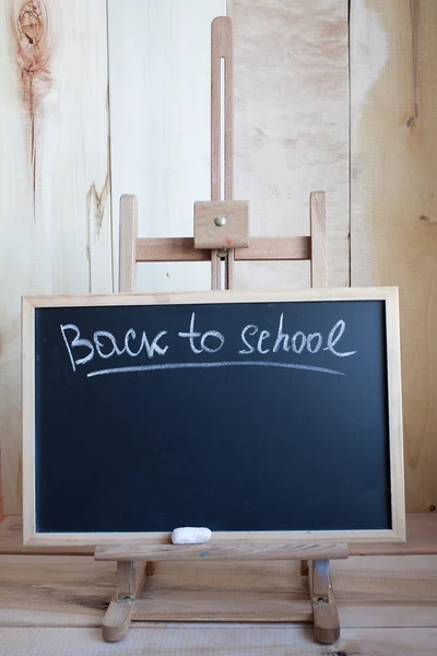 Back to school. Blackboard with easel with text. — Stock Photo, Image