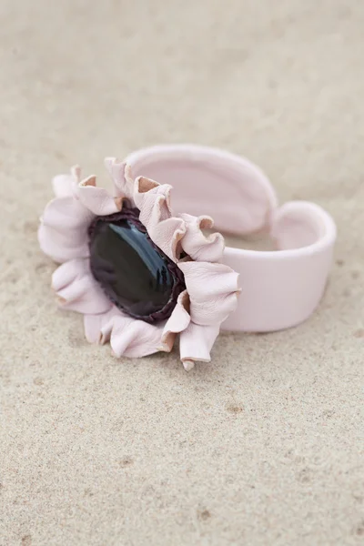 Handmade bracelet with leather on sand — Stock Photo, Image