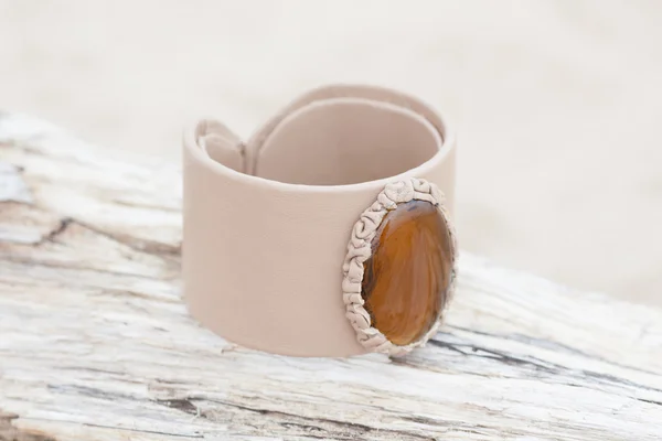 Handmade bracelet with leather on old wood — Stock Photo, Image