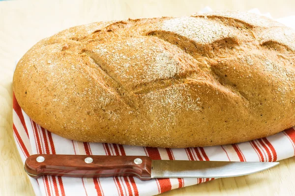 Loaf of bread on towel — Stock Photo, Image