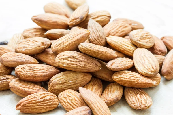 Almond on wooden background — Stock Photo, Image