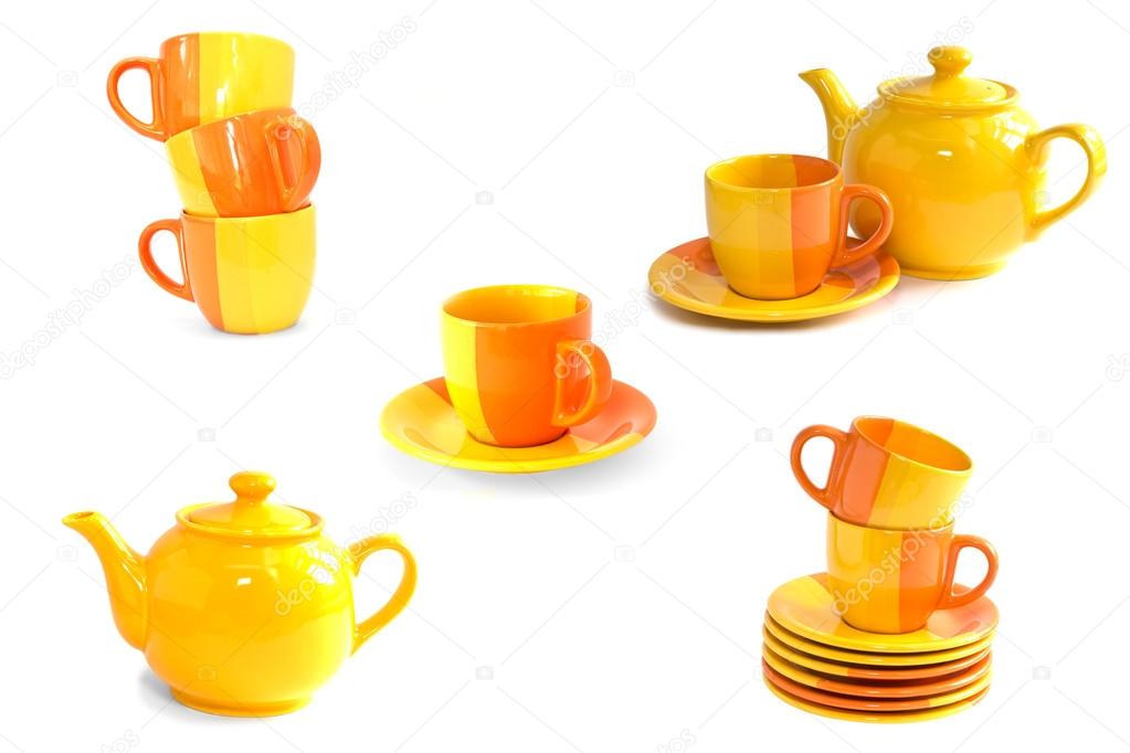 Set of colorful tea cups, teapots and saucers isolted on white