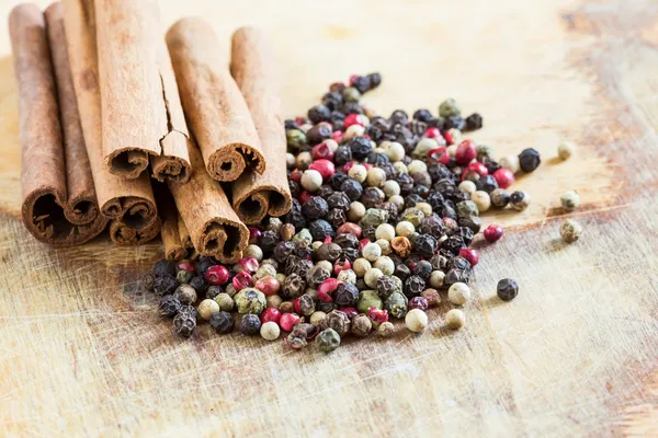 Mixed pepper on wooden background — Stock Photo, Image