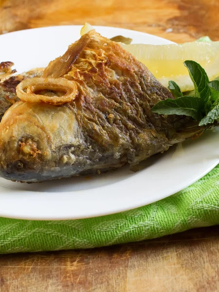 Fried fish on plate — Stock Photo, Image