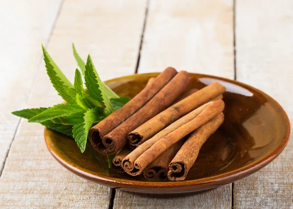 Cinnamon on plate — Stock Photo, Image