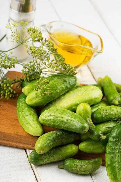 Fresh cucumbers on wooden background — Stock Photo, Image