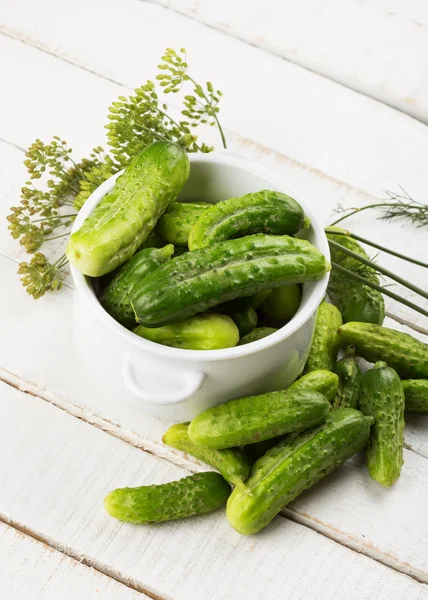 Fresh cucumbers on wooden background — Stock Photo, Image