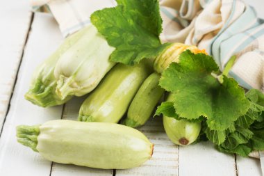 Fresh marrow on wooden table
