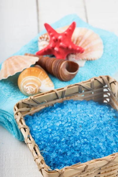 Sea salt in bucket on wooden background — Stock Photo, Image