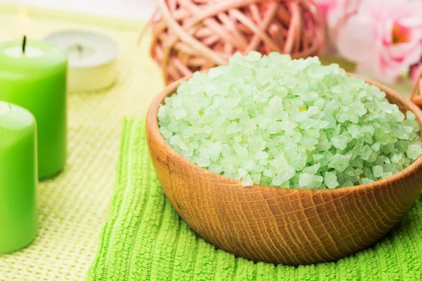 Sea salt in bowl with candle — Stock Photo, Image