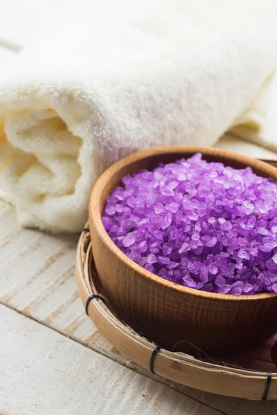 Sea salt in bowl on wooden background — Stock Photo, Image