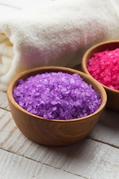 Sea salt in bowl on wooden background — Stock Photo, Image