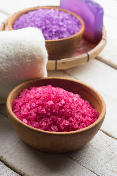 Sea salt in bowl on wooden background — Stock Photo, Image