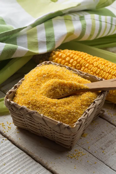 Corn meal on wooden background — Stock Photo, Image