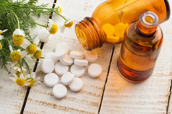 Herbs and bottle with medicines. Concept homeopathy. — Stock Photo, Image