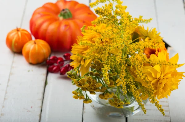 Autumn flowers on table — Stock Photo, Image