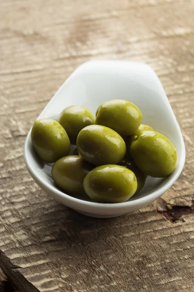 Green olive in bowl — Stock Photo, Image