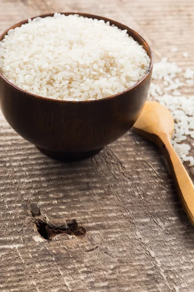 Rice in wooden bowl — Stock Photo, Image