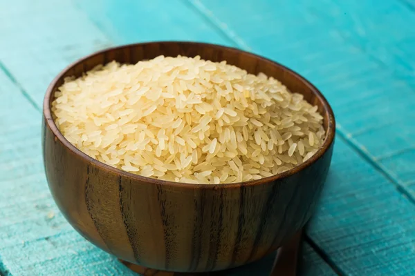 Rice in wooden bowl — Stock Photo, Image