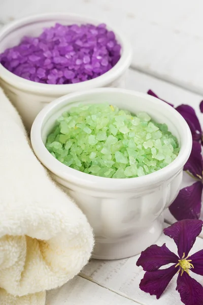 Sea salt in bowl on wooden background — Stock Photo, Image