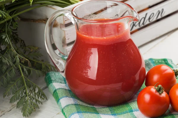 Fresh tomato juice in pitcher — Stock Photo, Image