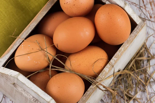 Chicken eggs on wooden background — Stock Photo, Image